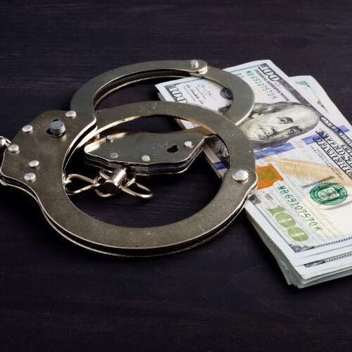 Handcuffs and Money for Bail Bonds